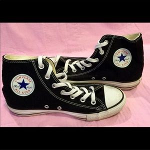 High top black chucks.